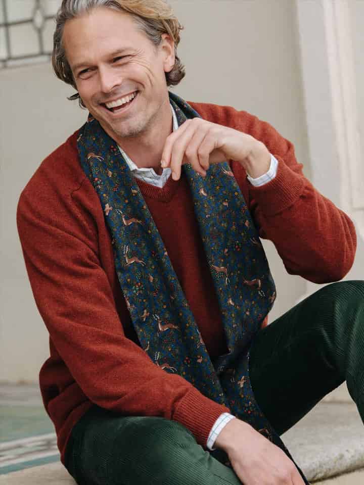 Model wears Rust Lambswool V Neck